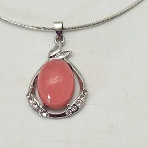 Silvertone omega type necklace with pink man-made stone and czs